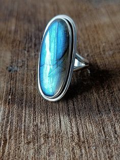 Handmade labradorite bohemian ring , you can wear this ring as a party wear ring .. Title -labradorite stone ring Stone color - blue Stone shape - oval Material - Sterling silver 925 Note - This is natural stone so shade may be little bit different .. we are giving you best quality rings on best price .. contact us for more quantity Blue Labradorite Bohemian Jewelry, Bohemian Blue Labradorite Jewelry, Bohemian Rings With Raw Stone, Bohemian Moonstone Ring With Large Stone For Gift, Bohemian Moonstone Ring With Large Stone As Gift, Bohemian Large Stone Moonstone Ring, Blue Bohemian Moonstone Ring, Bohemian Rings With Raw Stone For Healing, Bohemian Sterling Silver Jewelry With Raw Stone