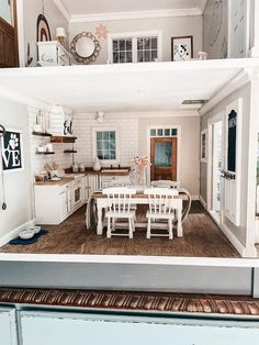 an open kitchen and dining room area in a doll house