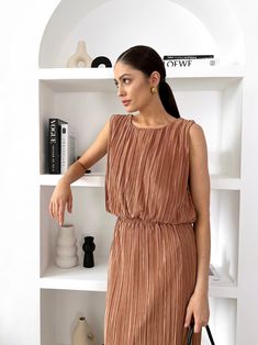 Description: - Delicate, feminine suit- You can mix the top and skirt with other wardrobe items - Size One size (XS-M) Compound: - Lining cotton 100% - Pleated polyester Chic Brown Mini Dress For Work, Chic Mini Dress With Pleated Waist For Day Out, Chic Brown Mini Dress, Brown Mini Dress For Office In Spring, Elegant Brown Mini Dress For A Day Out, Feminine Suit, Delicate Feminine, Top And Skirt, Cappuccino