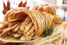 some bread sticks are stacked on top of each other