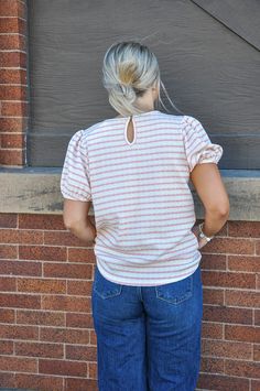 The Sweetheart Striped Puff Sleeve Top is a charming blend of retro-inspired design and contemporary style. Crafted with care in the USA, this top features several delightful details: Stripe Print on Knit Fabric: The stripe print adds a playful and timeless touch to the top, creating visual interest and a classic look. Keyhole Back with Button Closure: The keyhole back design, complemented by a button closure, adds a touch of elegance and allows for easy wear. Round Neck: The round neckline offe Kimono Crop Top, Crop Top Jacket, Winter Cap, Jumpsuit Shorts Rompers, Instagram And Snapchat, Puff Sleeve Top, Long Shorts, New Tops, Short Rompers