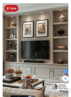 a living room filled with furniture and a flat screen tv on top of a entertainment center