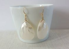 These beautiful earrings are made from real Mother of Pearl shells. These Mother of Pearl earrings are lightweight and very elegant. Beautiful as a Bride's Jewelry or as a Bridesmaid's Gift. The perfect choice for a unique gift to your mother, daughter, best friend or just because you deserve it. Each item is carefully packaged in an elegant jewelry box. If you would like to add a personalized note with your order, just write a note at checkout and I will send a small card with your gift to the Teardrop Mother Of Pearl Earrings For Gift, Elegant Mother Of Pearl Shell Earrings, Flower-shaped Mother Of Pearl Earrings For Wedding, Pearl Drop Shell-shaped Earrings In Mother Of Pearl, Elegant Shell-shaped Mother Of Pearl Earrings, Abalone Jewelry, Teardrop Bridal Earrings, Abalone Earrings, Pearl Beach