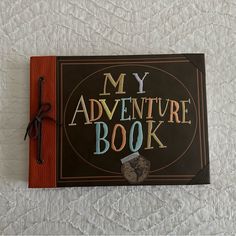 a book with the words my adventure book written on it