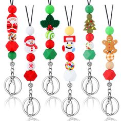 six christmas ornaments are hanging from the handles of keychains with different designs on them