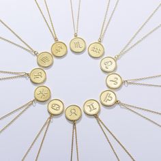 Dive into cosmic and minimalist style with our Zodiac Medallion Gold Coin Vermeil Necklace – a chic and dainty piece that's smaller than a dime but big on personality! Two-sided charm, double the mystique! One side features your zodiac astrology symbol, and on the flip, it's spelled out for that extra touch of celestial charm. Crafted with love, it boasts an 18K gold finish over hypoallergenic 925 sterling silver, appropriate for daily wear. The O-cable chain style and lobster claw clasp add sim Minimalist Zodiac Sign Charm Necklace, Sterling Silver Zodiac Sign Charm Necklace, Gold Minimalist Zodiac Charm Necklace, Minimalist Zodiac Sign Round Pendant Jewelry, Dainty Zodiac Sign Round Pendant Jewelry, Minimalist Gold Zodiac Sign Jewelry, Gold Minimalist Zodiac Sign Jewelry, Dainty Zodiac Sign Round Necklace, Minimalist Gold Zodiac Jewelry