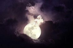 the full moon is seen through clouds in this dark night time photo taken by an unknown person