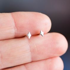 These lightweight tiny studs are an ideal addition to a look in casual style. They are minimalist and simple, attractive and modern. A great piece for everyday wear! These tiny earrings are made of fine and sterling silver. They are 2x3mm.Other tiny earrings: http://etsy.me/2jijuODThe earrings are made to order, it takes up to 5 days to ship them. You will receive them gift wrapped for no additional charge. Minimalist Diamond-shaped Everyday Jewelry, Minimalist Everyday Diamond-shaped Jewelry, Everyday Minimalist Diamond-shaped Jewelry, Minimalist Diamond-shaped Earrings For Gift, Minimalist Silver Diamond-shaped Jewelry, Tiny Minimalist Sterling Silver Earrings, Minimalist Sterling Silver Diamond-shaped Earrings, Minimalist Sterling Silver Diamond Cut Earrings, Almandine Garnet