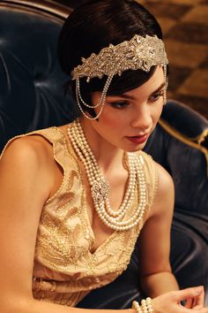 Roar back 100 years to unprecedented golden 20s with this headband, which perfectly create an elegant and sophisticated Gatsby style. Features: Sparkling rhinestones Art deco style Adjustable elastic band Intricately arranged rhinestone pattern Regal Gold Headpiece For Wedding, Gold Embellished Headpieces For Wedding, Regal Gold Headpieces For Weddings, Regal Gold Wedding Headpiece, Gold Crystal Embellished Headpieces For Wedding, Glamorous Crystal Embellished Headband, Gold Beaded Wedding Headpieces, Elegant Crown Hair Accessories For Parties, Glamorous Wedding Jewelry Headband