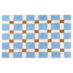 a blue and white rug with brown squares on it