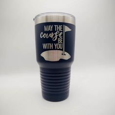 a black and silver tumbler with the words may the course be with you on it