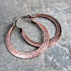 "Large, earthy and beautiful Copper Rio hoop earrings are hand forged from large 10 gauge copper wire. Ear wires are made from *18 gauge sterling silver. They have a satin brushed finish highlighting their beautiful hammered texture and color. Perfect for a weekend in Rio or anywhere a pair big boho hoops are needed to add that edgy punch to your wardrobe! The pair in the photos have an oxidized finish. NOTE: Made To Order...Please allow 7 - 10 business days for completion. Earrings measure 2.25 Handmade Small Hoop Copper Earrings, Handmade Small Copper Hoop Earrings, Artisan Copper Hoop Earrings Nickel Free, Hammered Copper Hoop Earrings As Gift, Copper Hammered Hoop Earrings As Gift, Artisan Electroformed Hoop Earrings, Artisan Bronze Copper Hoop Earrings, Artisan Nickel Free Copper Hoop Earrings, Small Hoop Hammered Copper Earrings