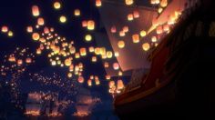 many paper lanterns are floating in the air above a boat and other boats at night