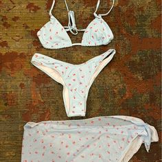 Nwot Light Blue Bikini With Pink Flowers And Matching Sheer Sarong Size Small (Bottoms Are Not Full Coverage) Never Worn Fitted Cherry Print Swimwear For Spring, Spring Beachwear Swimwear With Cherry Print, Cherry Print Swimwear For Beach Season, Cherry Print Swimwear For Vacation Beach Season, Summer Cherry Print Swimwear For Vacation, Spring Cherry Print Swimwear For Poolside, Cherry Print Swimwear For Vacation, Cherry Print Swimwear For Summer, Cherry Print Beachwear Swimwear