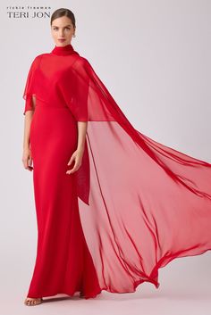 Transform any occasion into a moment of sheer elegance with our crepe slip cape gown-a masterpiece of contemporary couture. This stretch slip dress features a sleek and elegant silhouette, while the chiffon cape overlay adds a touch of drama to the ensemble. Draping from the front to the back, the chiffon cape creates Red Carpet Affair, Chiffon Cape, Cape Gown, Gala Events, Mock Neckline, Crepe Dress, Mother Of The Groom, Mother Of The Bride Dresses, Dusty Blue