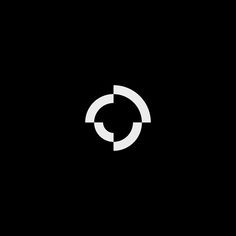 a black and white logo with the letter c in it's center, on a dark background