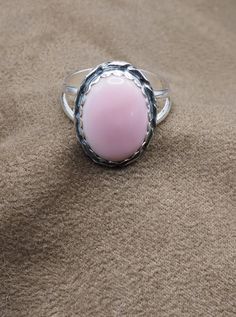 "Unique Cowrie Shell Ring US Size 10. Can be resized for no additional charge Top: 20 x 16 mm 3/4\" x 5/8 \" Weight 6.5 Grams.  Sterling Silver 925  Handmade $65 Exclusively Designed by Richard James for richlo jewelry Check out our other fine jewelry at: https://www.etsy.com/shop/arizonagemstudio In many cultures, cowrie shells were seen as a symbol of wealth and prosperity. Cowrie shells have a long history of being used as a form of currency. In fact, they are one of the oldest forms of money in the world, with evidence of their use dating back to ancient civilizations in Africa, Asia, and the Pacific." Ocean-inspired Cowrie Shell Jewelry, Beaded Cowrie Shell-shaped Jewelry, Casual Cowrie Shell-shaped Jewelry, Bohemian Shell-shaped Pink Jewelry, Beach Cowrie Shell-shaped Earrings, Shell Ring, Cowrie Shell, Sterling Ring, Handmade Ring