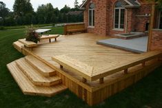 a large wooden deck with steps leading up to it