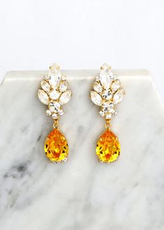 Yellow Chandelier Earrings, Yellow Topaz Drop Earrings, Yellow Bridal Drop Earrings, Bridal Chandelier Earrings, Yellow Crystal Earrings MATCHING BRACELET: https://etsy.me/36b9gbO Add a sophisticated, stylish glow to any outfit with these beautiful lightweight crystal-embellished chandeliers. Luxury Yellow Gold Bollywood Earrings, Yellow Teardrop Earrings For Wedding, Yellow Dangle Earrings For Wedding, Yellow Dangle Chandelier Earrings For Wedding, Panama Wedding, Yellow Chandelier, Bridal Chandelier Earrings, Swarovski Crystal Chandelier, Bridal Drop Earrings