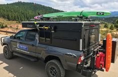 a truck with a kayak attached to the back