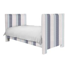 a bed with blue and white striped headboard on it's side, against a white background