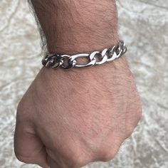 Solid stainless steel Figaro link bracelet. Bracelet is 8.5" inch long x 12 MM thick. Very good weight at approx. 43 grams. 3 circular & one elongated link pattern. S. Steel stamp on the double latch box lock. 100% FREE SHIPPING in USA. Order now! Figaro Bracelet, Custom Grillz, Steel Stamp, Hip Hop Jewelry, Stainless Steel Jewelry, Stainless Steel Bracelet, Link Bracelets, Jewelry Stores, Mens Bracelet