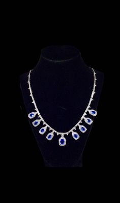 "The past will always return in the fashion world and this piece is back for round two! In the 1920's ladies of class wore the most opulent dresses with jewelry to match. As the years continued, jewelry makers tailored pieces to fashion and trends which resulted in affordability for style. Presenting this Absolutely Show Stopping Vintage 30 Carat Cobalt Tanzanite Estate Necklace Featuring Elegant Teardrop Gemstone Designs With White Sapphire Accents. This is a wonderful example of the great Crow Elegant Sapphire Drop Necklaces, Elegant Sapphire Pear-shaped Necklace, Elegant Pear-shaped Sapphire Necklace, Elegant Tanzanite Necklace For Formal Occasions, Elegant Formal Tanzanite Necklaces, Elegant Formal Tanzanite Necklace, Formal Sapphire Teardrop Necklace, Formal Sapphire Drop Necklaces, Formal Sapphire Pear-shaped Necklace