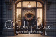 the front door of a building with a wreath on it that says, snobbby drops