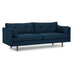 a blue couch sitting on top of a white floor