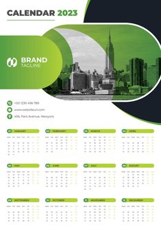 a green and black calendar with the city skyline in the background