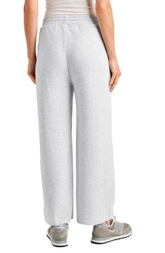 It's all about relaxed weekend vibes with these wide-leg sweatpants in a breezy cropped length. 25" inseam; 22" leg opening; 10 1/2" front rise; 14" back rise Elastic/drawstring waist 65% polyester, 31% viscose, 4% elastane Machine wash, tumble dry Imported Relaxed Sweats For Lounging, Sporty Wide Leg Bottoms For Relaxation, Athleisure Pants With Comfort Waistband For Relaxation, Relaxed Sweats For Leisure In Spring, Relaxed Spring Leisure Sweats, Athleisure Straight Leg Bottoms For Relaxation, Athleisure Straight Leg Sweatpants For Relaxation, Full-length Athleisure Sweatpants For Relaxation, Athleisure Full-length Sweatpants For Relaxation