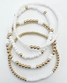 this set of 4 is made with 14k gold filled beads. They will not tarnish & are allergy safe All you need to do it choose your color! White And Gold Bracelet, Clay Bead Necklace, Bracelet Inspo, Bead Making, Bracelets Design, Beads Bracelet Design, Arm Party, Bracelet Ideas, Beaded Bracelets Diy