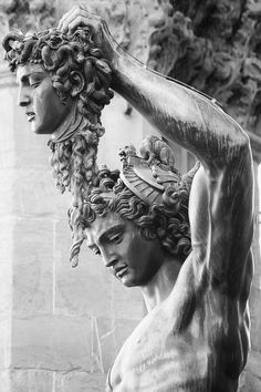 black and white photograph of a statue with curly hair