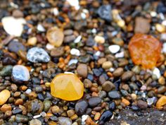 several different colored rocks and gravel on the ground