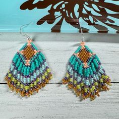 Handmade Seed Bead Beaded Earrings Native American Themed 2.5” Long Multicolor Add A Touch Of Boho Chic To Your Look With Our Handmade Seed Beaded Fringe Earrings. These Lightweight Earrings Are Not Only Stylish But Also Comfortable To Wear All Day Long. With Their Vibrant Multicolored Beads, They Bring A Playful And Eye-Catching Element To Any Ensemble. Beads Used - Miyuki Colors - Turquoise, Mint Turquoise Lined, Chartreuse, Lime, Peach, Amethyst Measurements Drop Length - 2 Inches Length With Beach Beaded Earrings With Colorful Beads, Bohemian Blue Beaded Earrings With Large Beads, Artisan Blue Beaded Earrings With Colorful Beads, Blue Bohemian Beaded Earrings With Large Beads, Brown Beaded Earrings For The Beach, Brown Round Beaded Earrings For Beach, Artisan Blue Beaded Earrings For The Beach, Brown Beaded Earrings For Beach, Colorful Beaded Brown Earrings For Beach