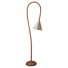 a lamp that is on top of a wooden stand with a white light in the middle