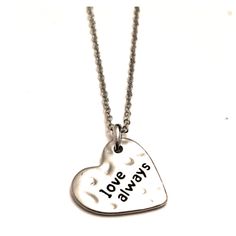 This 'Silvertone Hammered Pattern Heart Shaped Love Always Necklace' Is 18 Inches Long With A 3/4 Inch Pendant. This Item Is Perfect For Yourself Or For Gift Giving. (Jlu9910) (Oggnec) (Oggval) Silver Adjustable Heart Necklace For Valentine's Day, Silver Hand Stamped Heart Necklace For Anniversary, Silver Stamped Charm Necklaces For Valentine's Day, Silver Stamped Charm Necklace For Valentine's Day, Valentine's Day Silver Stamped Charm Necklaces, Silver Heart Necklace With Hand Stamped Details, Cool Jewelry, Love Always, Gift Giving