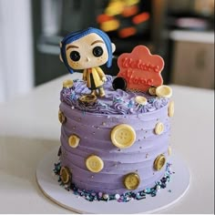 there is a purple cake with a doll on top