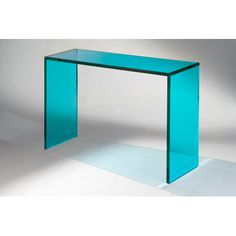 a glass console table with one shelf on the bottom and two shelves below it, against a white background