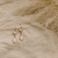 Our Aria Moonstone Earrings are simply beautiful. Made with genuine rainbow moonstone, they're made to stand out. They were designed for the classic, yet bohemian chic bride who wants a dainty look on her wedding day.FEATURES Genuine Rainbow Moonstone Teardrop set in 16k gold vermeil or sterling silver 16k gold, rose gold, or rhodium plated fan 100% nickel free, great for sensitive ears Chic Brides, Bohemian Bridal, Earrings Bohemian, Moonstone Earrings, Chain Extenders, Bohemian Chic, Gold Filled Jewelry, Polish Jewelry, Sensitive Ears