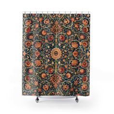 a shower curtain with an ornate design on it's side and wheels in the middle