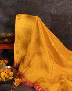 "Experience the vibrant beauty of our Handwoven Narali Kath yellow pure silk yeola paithani. Handcrafted with traditional weaving techniques, each piece is a unique work of art. Add a touch of elegance and tradition to your wardrobe (without breaking the bank!). No two are alike. Limited edition!" Navratri Silk Dupatta With Tilla Detail, Silk Dupatta With Tilla For Navratri, Gold Handloom Traditional Wear For Diwali, Yellow Katan Silk Bollywood Traditional Wear, Mustard Traditional Wear For Festivals, Yellow Bollywood Katan Silk Traditional Wear, Festive Mustard Traditional Wear For Festivals, Gold Saree For Traditional Ceremonies And Festivals, Transitional Chanderi Saree With Tilla Details