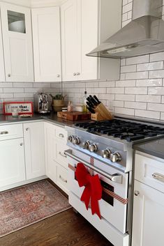 a white stove top oven sitting inside of a kitchen