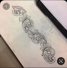 a pencil drawing of an ornate design on paper