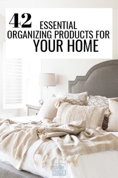 a bed with pillows and blankets on top of it in front of a window that says, 12 essential organizing products for your home