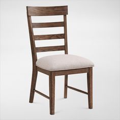 a wooden chair with a beige upholstered seat and back cushion on a white background