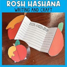 the book rosh hashanana writing and craft is open on a wooden table