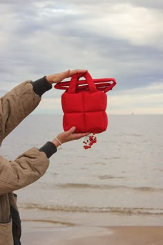 New kid on the block, mini version of our Pillow Puffer bag : Baby Pillow Essential bag in gorg red colour 🍊 A spectacular accessory for your look in any season. Аlso our novelty: from now on your garment will have its own dust bag 🌼 The most huggable piece in your wardrobe. This bag is made of waterproof raincoat fabric with cotton lining. Needless to say this is the epitome of soft & cozy. Perfect piece for everyday life. Bag is equipped with two pockets for small items and convenient handle Mini Fabric Bag, Trendy Red Box Bag For Shopping, Casual Red Shoulder Box Bag, Red Bucket Box Bag For Everyday, Everyday Red Bucket Box Bag, Trendy Red Box Bag As Gift, Trendy Red Box Bag For Gifts, Trendy Red Box Bag With Double Handle, Red Pouch Box Bag For Daily Use