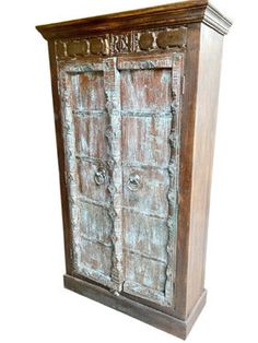 an old wooden cabinet with two doors