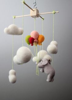 an elephant is flying in the sky with balloons